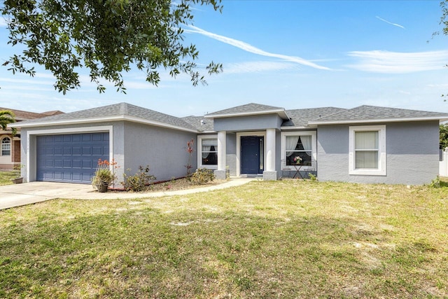 view of front of house featuring concrete driveway, an attached garage, a front lawn, and stucco siding