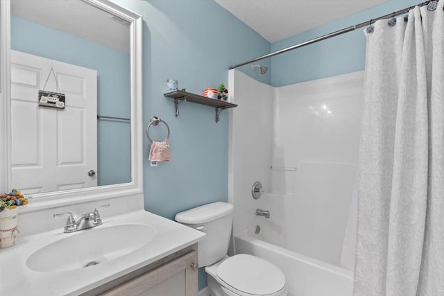 bathroom featuring vanity, toilet, and shower / bath combo with shower curtain