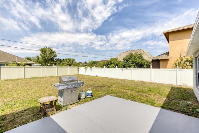 view of yard with a patio area, a mountain view, and a fenced backyard