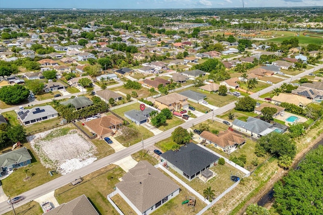 birds eye view of property with a residential view