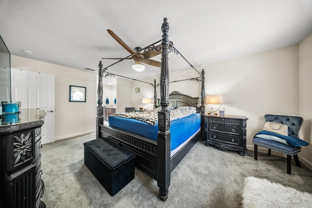 carpeted bedroom featuring visible vents, baseboards, a textured ceiling, and a ceiling fan