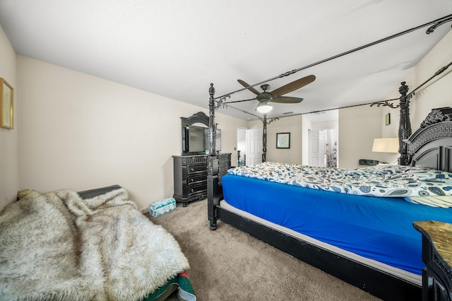 bedroom featuring a ceiling fan and carpet