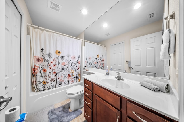 bathroom with vanity, shower / tub combo, toilet, and visible vents