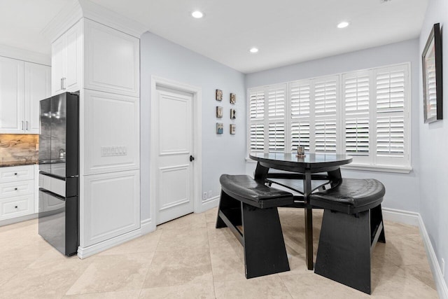 dining area featuring light tile patterned flooring, recessed lighting, and baseboards