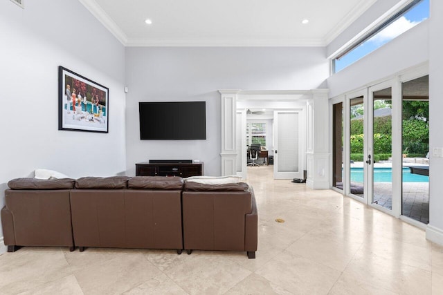 living room with visible vents, ornamental molding, recessed lighting, french doors, and a towering ceiling