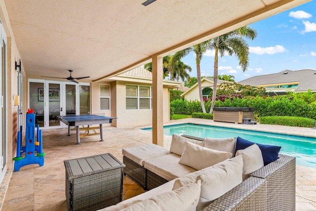 outdoor pool featuring a patio area, a hot tub, outdoor lounge area, and ceiling fan