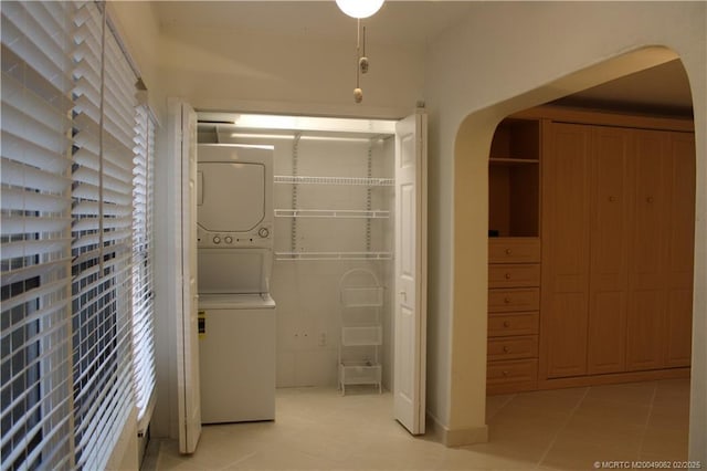 interior space with stacked washer and dryer