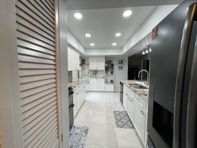 bathroom with tile patterned flooring, vanity, and recessed lighting