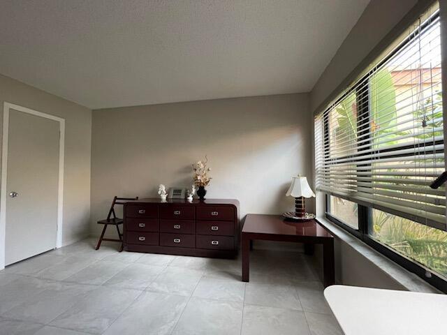 sitting room with light tile patterned floors