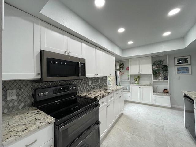 kitchen featuring black appliances, white cabinetry, open shelves, and a raised ceiling
