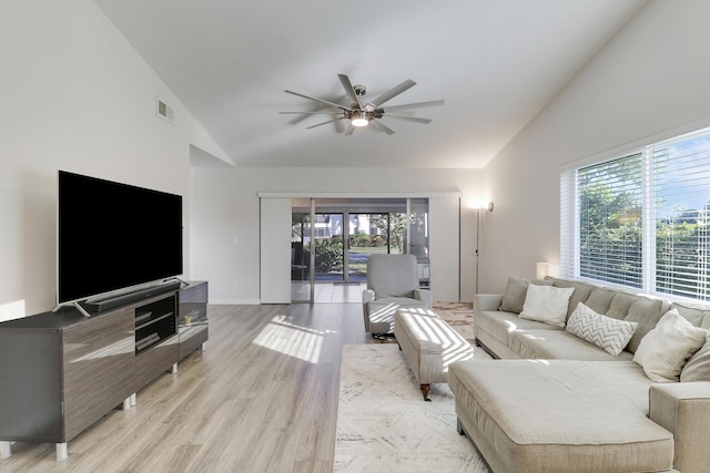 living room featuring visible vents, plenty of natural light, light wood-style floors, and ceiling fan