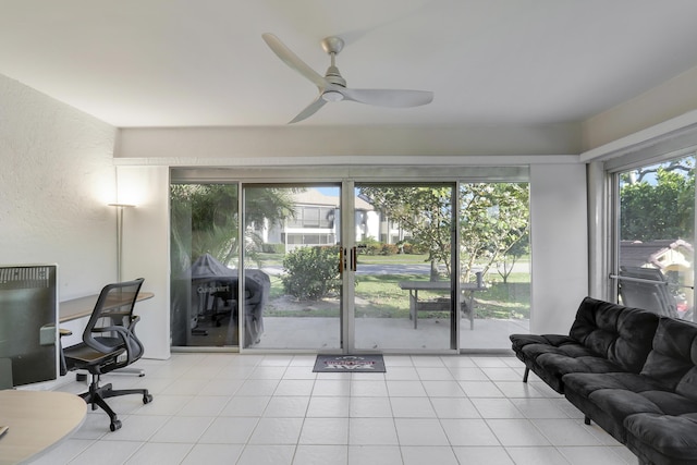 tiled office featuring ceiling fan