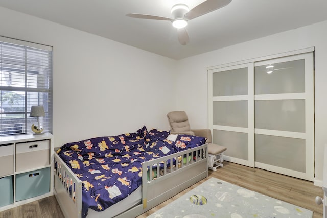 bedroom featuring a ceiling fan and wood finished floors
