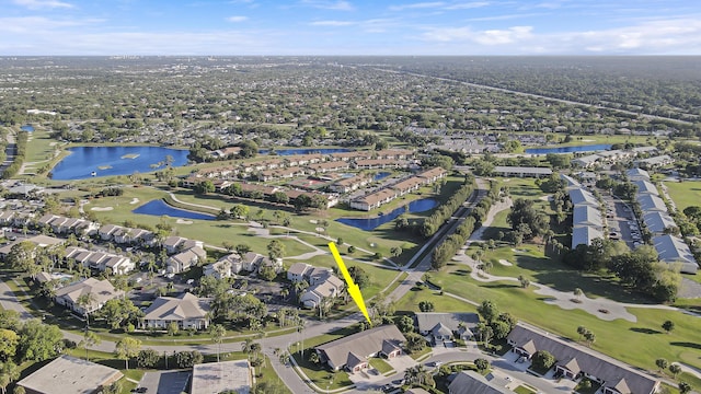 bird's eye view with a residential view, view of golf course, and a water view