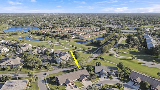 bird's eye view with a residential view, golf course view, and a water view