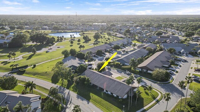 birds eye view of property featuring a residential view and a water view