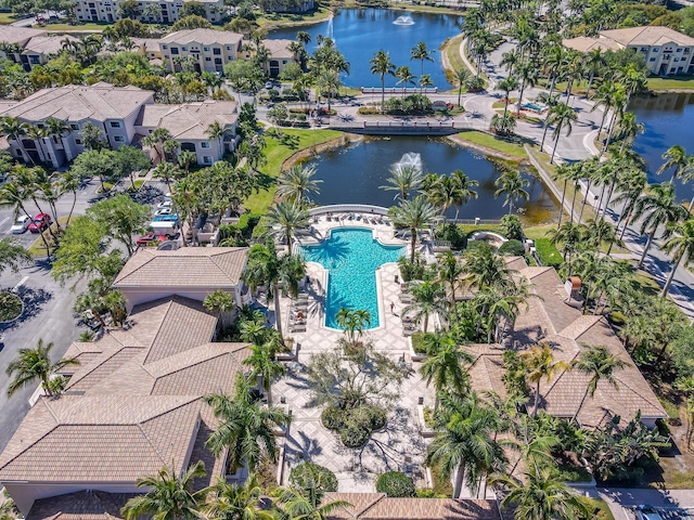 bird's eye view of a pool and a nearby body of water