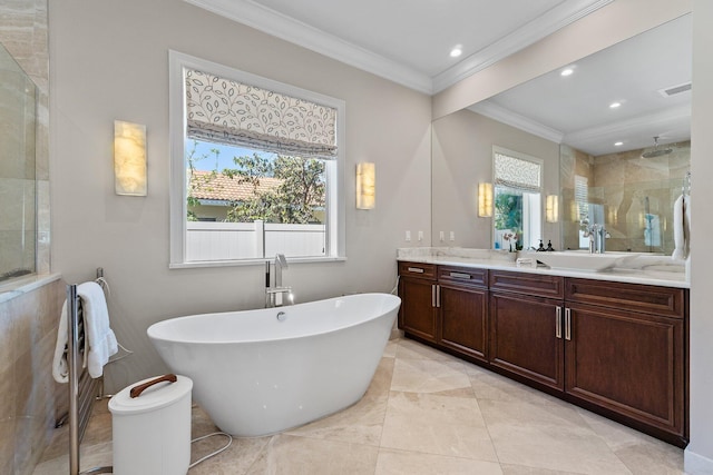 full bathroom with a wealth of natural light, crown molding, tiled shower, and vanity