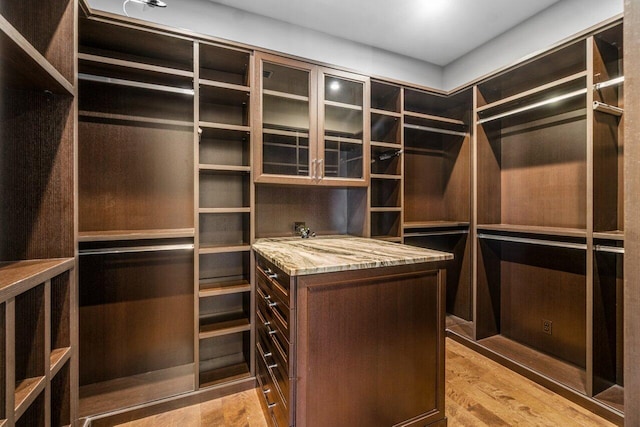 spacious closet with light wood finished floors