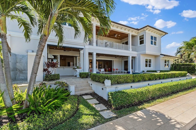 back of property featuring a patio area, ceiling fan, a balcony, and stucco siding