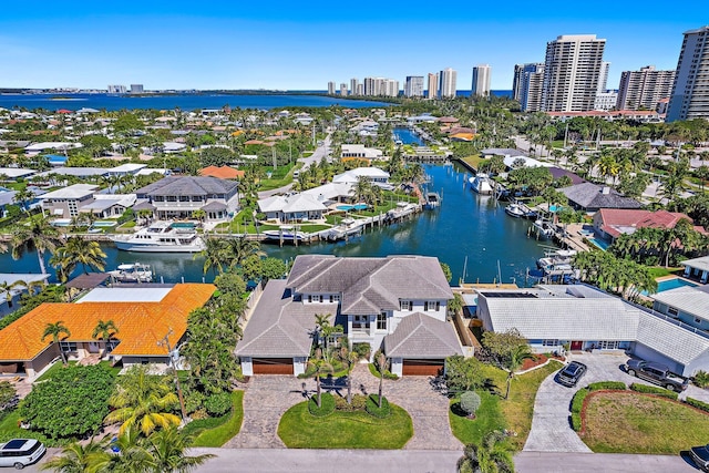 bird's eye view featuring a city view, a water view, and a residential view