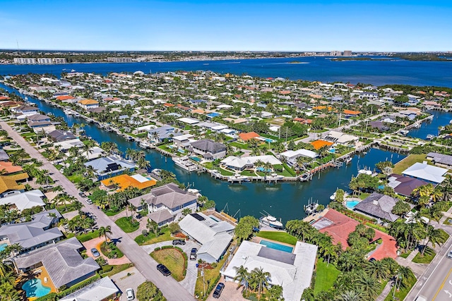 bird's eye view featuring a residential view and a water view