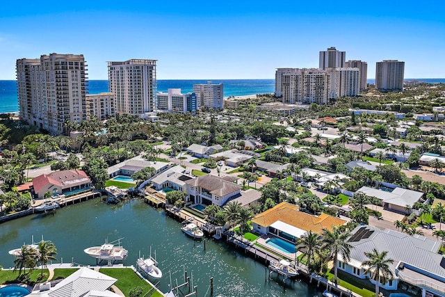 drone / aerial view with a view of city and a water view