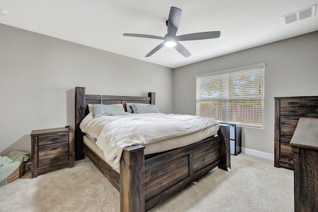 3558 SW Pisano St, Port Saint Lucie, FL 34953 - bedroom featuring visible vents, light carpet, baseboards, and a ceiling fan