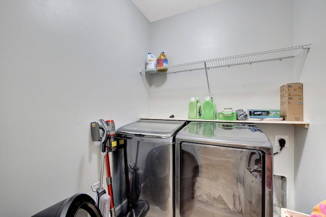 3558 SW Pisano St, Port Saint Lucie, FL 34953 - laundry room featuring washing machine and clothes dryer and laundry area