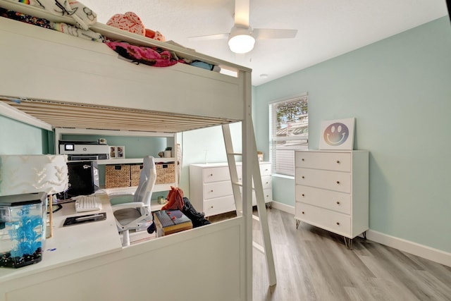 3558 SW Pisano St, Port Saint Lucie, FL 34953 - bedroom featuring wood finished floors, baseboards, and ceiling fan