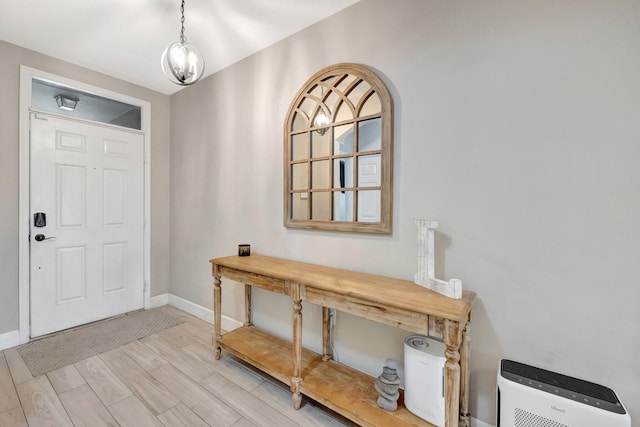 3558 SW Pisano St, Port Saint Lucie, FL 34953 - foyer entrance featuring light wood-type flooring and baseboards