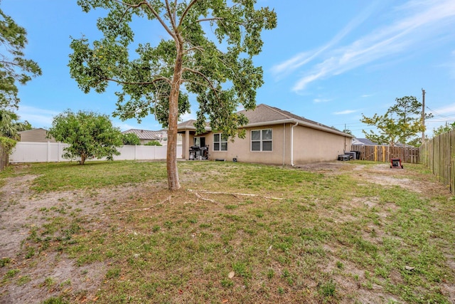 3558 SW Pisano St, Port Saint Lucie, FL 34953 - view of yard with a fenced backyard
