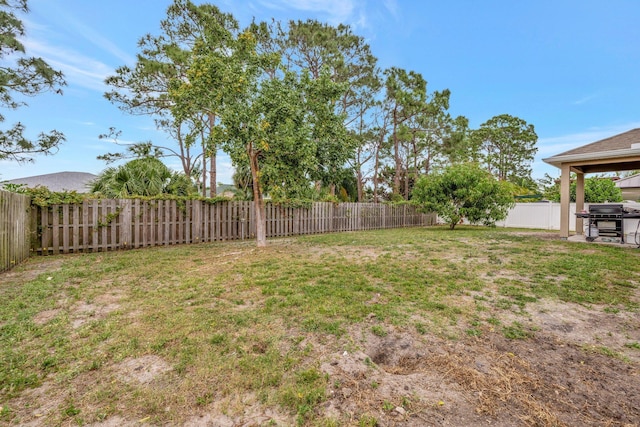 3558 SW Pisano St, Port Saint Lucie, FL 34953 - view of yard featuring a patio and a fenced backyard