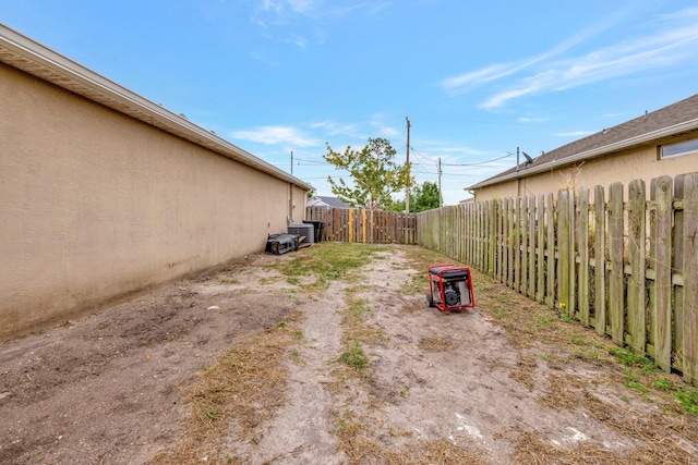 3558 SW Pisano St, Port Saint Lucie, FL 34953 - view of yard featuring a fenced backyard