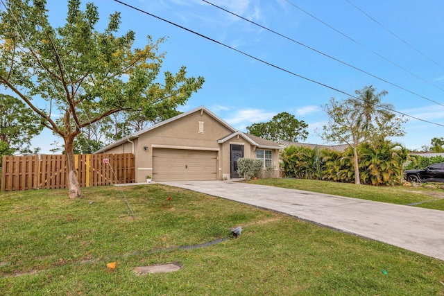 3558 SW Pisano St, Port Saint Lucie, FL 34953 - view of front of property featuring an attached garage, a front lawn, fence, stucco siding, and driveway