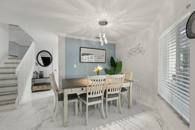 dining area with stairway, marble finish floor, crown molding, and baseboards