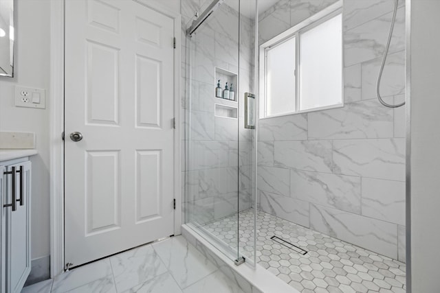 full bathroom with marble finish floor and a stall shower