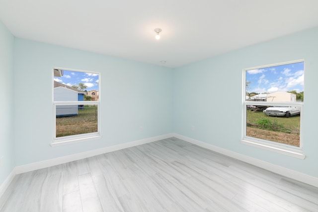 3897 NW 19th Ave, Okeechobee, FL 34972 - empty room featuring baseboards and light wood-style flooring