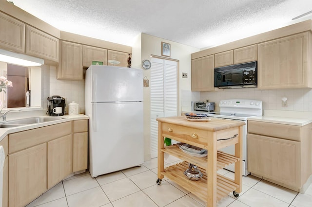 kitchen featuring light brown cabinets, tasteful backsplash, white appliances, light countertops, and light tile patterned floors