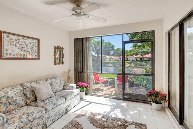 tiled living room with ceiling fan