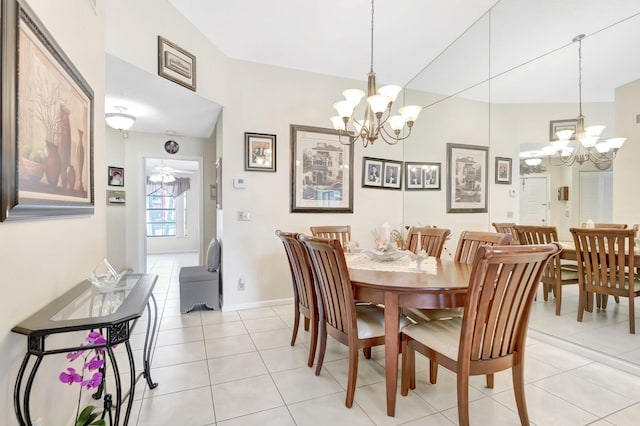 dining room with light tile patterned floors, baseboards, and an inviting chandelier