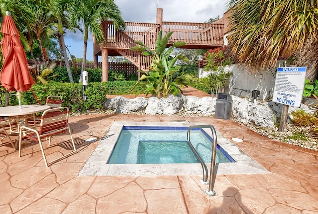 view of swimming pool with outdoor dining space, a patio, and stairs