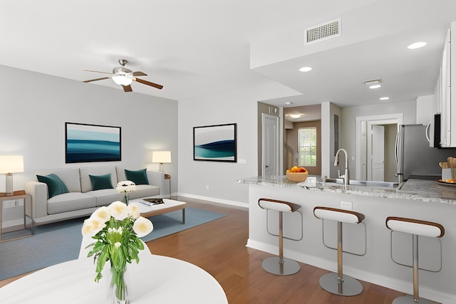 155 Waterford Dr, Jupiter, FL 33458 - living room featuring dark wood-style flooring, baseboards, ceiling fan, and recessed lighting