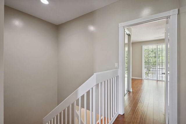155 Waterford Dr, Jupiter, FL 33458 - hall featuring an upstairs landing, hardwood / wood-style floors, baseboards, and recessed lighting