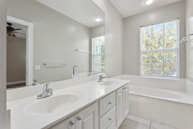 155 Waterford Dr, Jupiter, FL 33458 - bathroom featuring a bath, tile patterned flooring, double vanity, and a ceiling fan