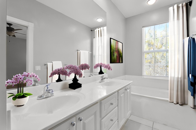 155 Waterford Dr, Jupiter, FL 33458 - full bath with a garden tub, double vanity, tile patterned flooring, and a ceiling fan