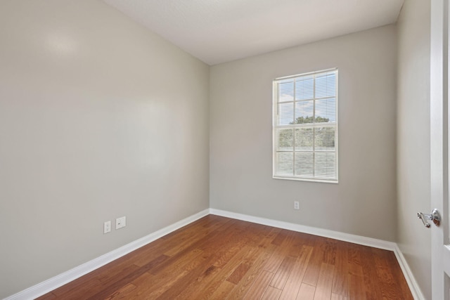 155 Waterford Dr, Jupiter, FL 33458 - unfurnished room with wood finished floors and baseboards