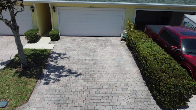 155 Waterford Dr, Jupiter, FL 33458 - garage featuring decorative driveway