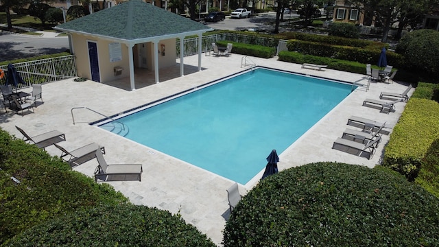 155 Waterford Dr, Jupiter, FL 33458 - community pool with fence and a patio area
