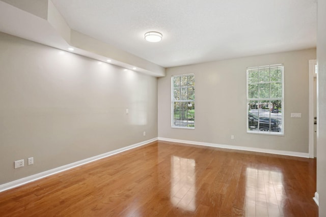 155 Waterford Dr, Jupiter, FL 33458 - empty room with wood finished floors, baseboards, and recessed lighting